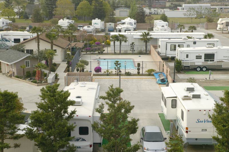 An overview of Recreational Vehicles and trailers parked in a trailer camp outside of Bakersfield, CA. An overview of Recreational Vehicles and trailers parked in a trailer camp outside of Bakersfield, CA