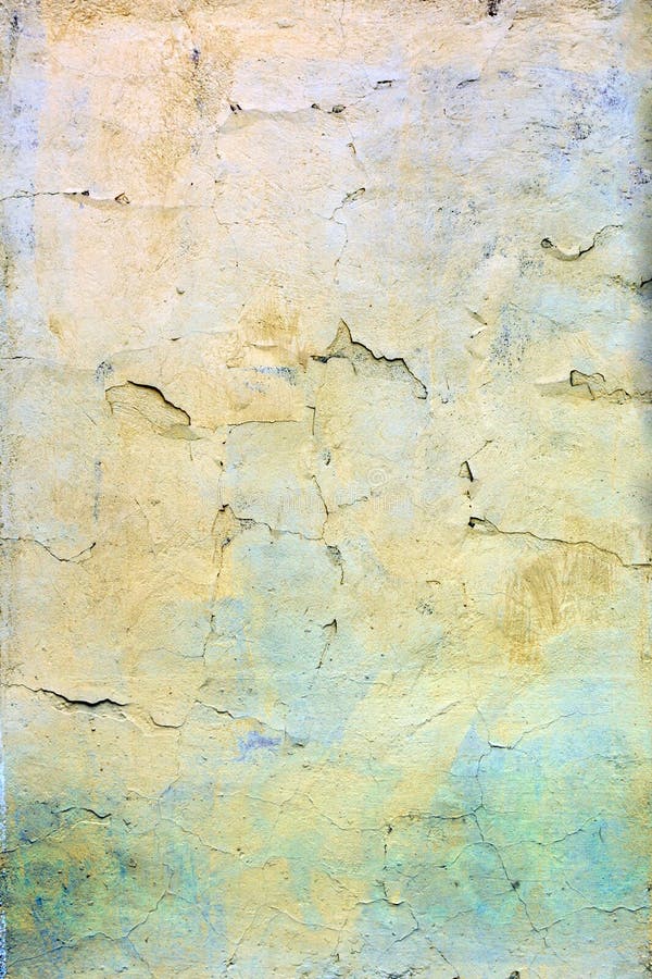Una pared con la pintura amarilla y azul agrietada Fondo hermoso Textura de la vieja cubierta con las grietas imagen de archivo libre de regalías Una pared con la pintura amarilla y azul agrietada Fondo hermoso Textura de la vieja cubierta con las grietas imagen de archivo libre de regalías