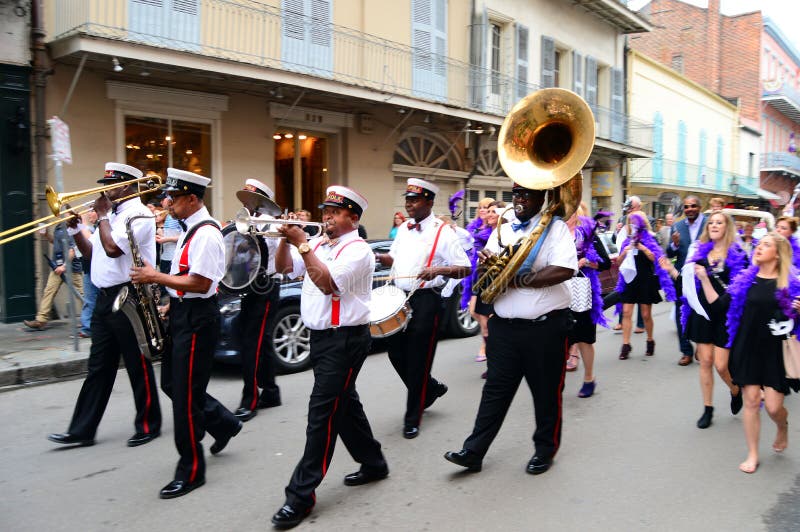 A Second Line leads a procession through the French Quarter of New Orleans. A Second Line leads a procession through the French Quarter of New Orleans