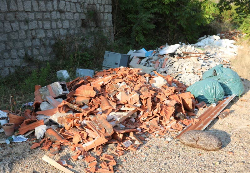 unauthorized storage of bricks and rubbles on the road