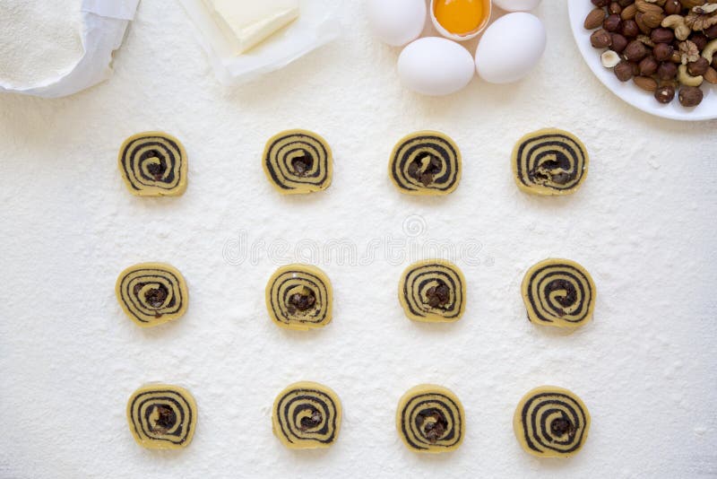 Unbaked cookies with poppy seeds, raisins and nuts. Ingredients for making cookies. Top view, overhead, stock photography Unbaked cookies with poppy seeds, raisins and nuts. Ingredients for making cookies. Top view, overhead, stock photography