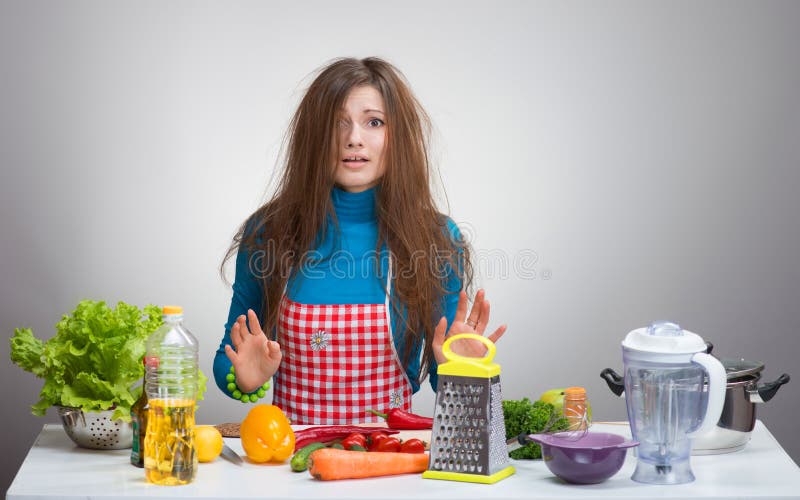 Uncombed confused woman in the kitchen stock image Uncombed confused woman in the kitchen stock image