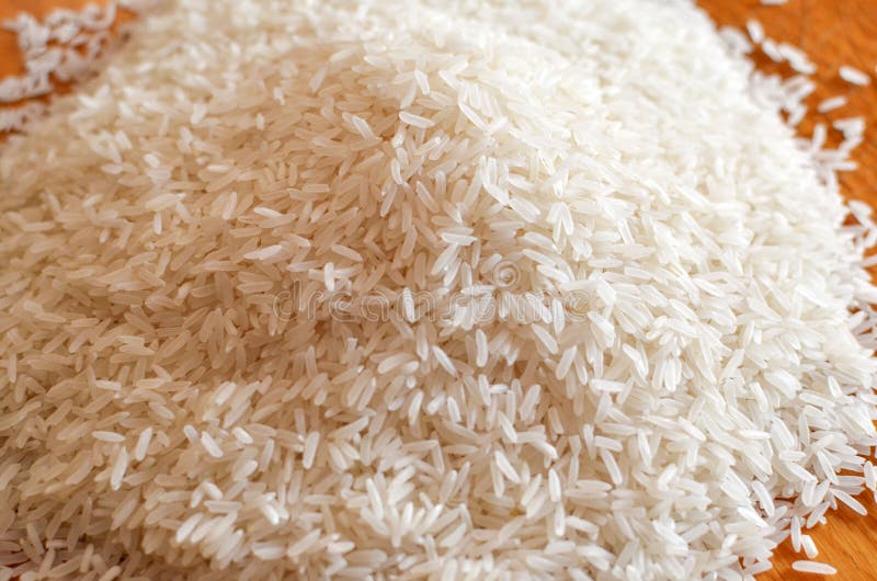 Uncooked Asian White Rice or Long White Rice Grain As Background Stock