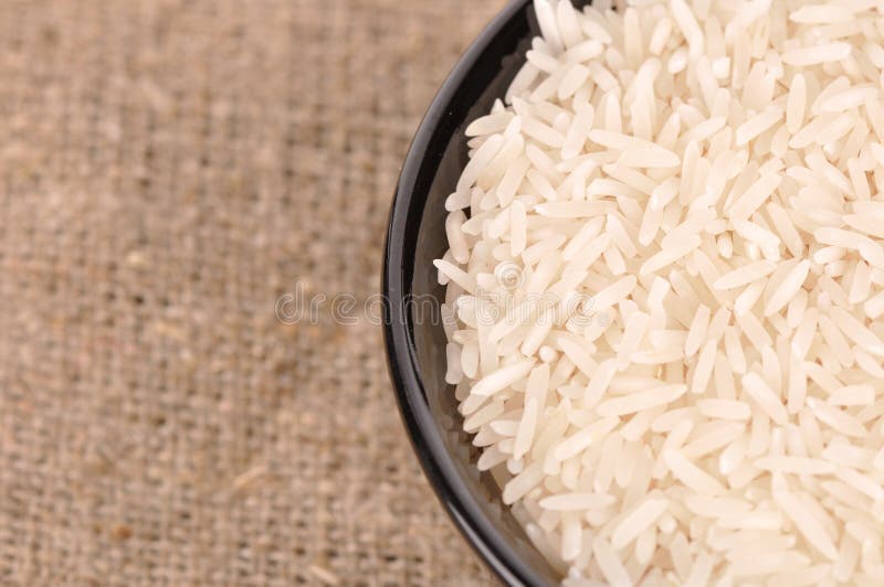 Uncooked basmati rice in a ceramic bowl