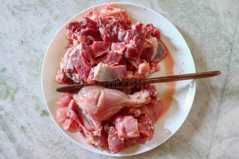 Uncooked Chicken & Mutton side-by-side view royalty free stock images