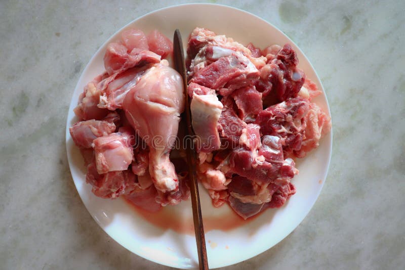 Uncooked Chicken & Mutton side-by-side view stock image