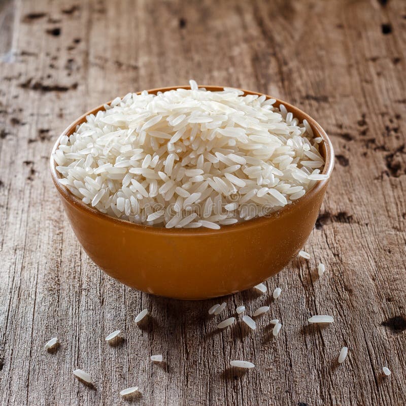 Uncooked Dry Rice in Brown Bowl Stock Photo - Image of brown, cuisine