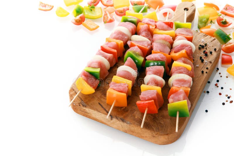 Uncooked meat and vegetable kebabs