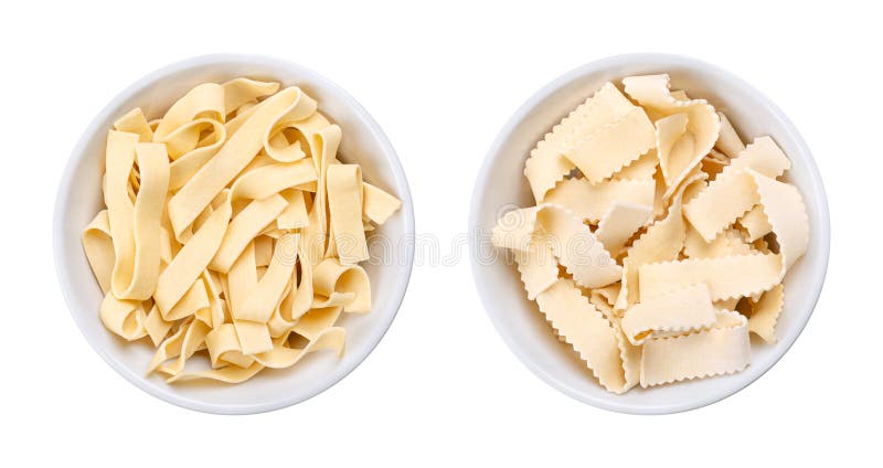 Two types of short thick ribbon pasta, uncooked Italian laminated pasta royalty free stock photography