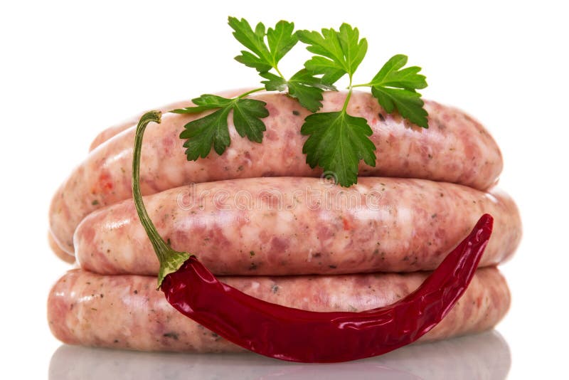 Uncooked Sausage, Red Pepper and Parsley Isolated on White. Stock Photo