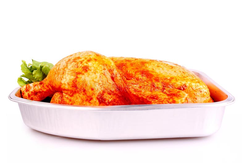 Raw Whole Marinated Chicken in Aluminum Foil Tray Isolated Stock Image