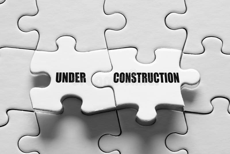 Under Construction Message Surrounded by Puzzle Pieces. site Construction or Maintenance