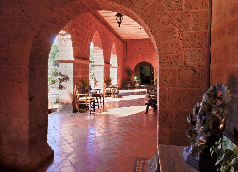 Under the red brick arches