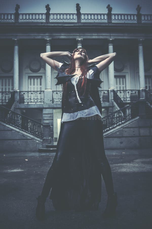 Under the storm, Beautiful vampire woman in palace gate, gothic stock images Under the storm, Beautiful vampire woman in palace gate, gothic stock images