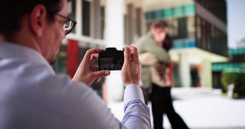 Undercover Agent Capturing Suspicious Activity stock photo
