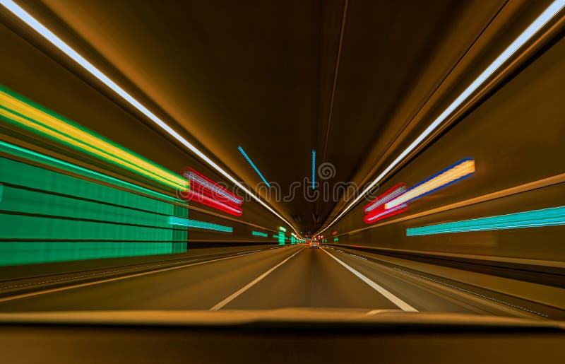 Underground Car Tunnel with Light Trails and Leading Lines. Stock Photo