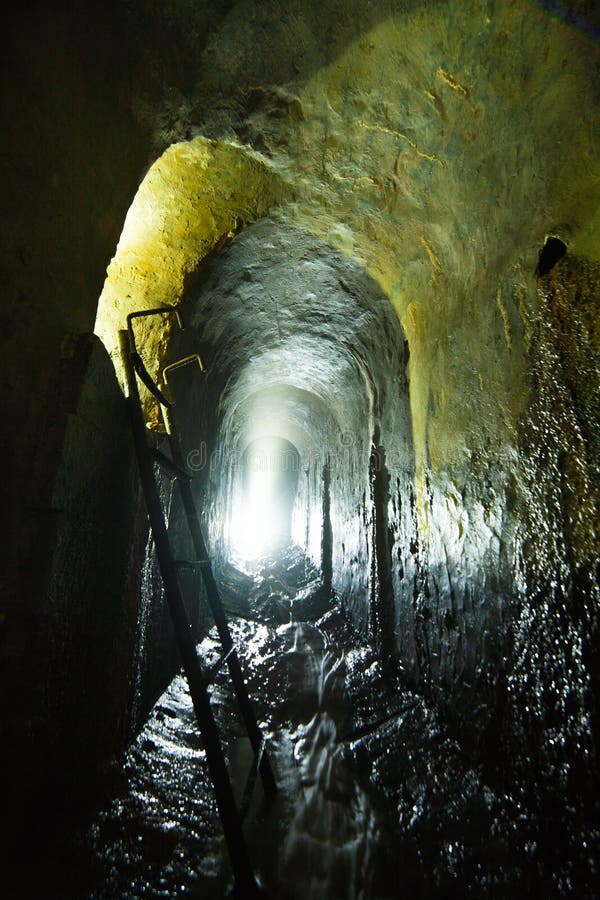 Underground Tunnel With Water. Stock Photo Image of pipes, military
