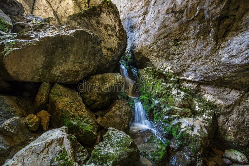 Underground river and waterfall in Romania. Underground river and waterfall from Cetatile Ponorului cave, Romania royalty free stock photo Underground river and waterfall in Romania. Underground river and waterfall from Cetatile Ponorului cave, Romania royalty free stock photo
