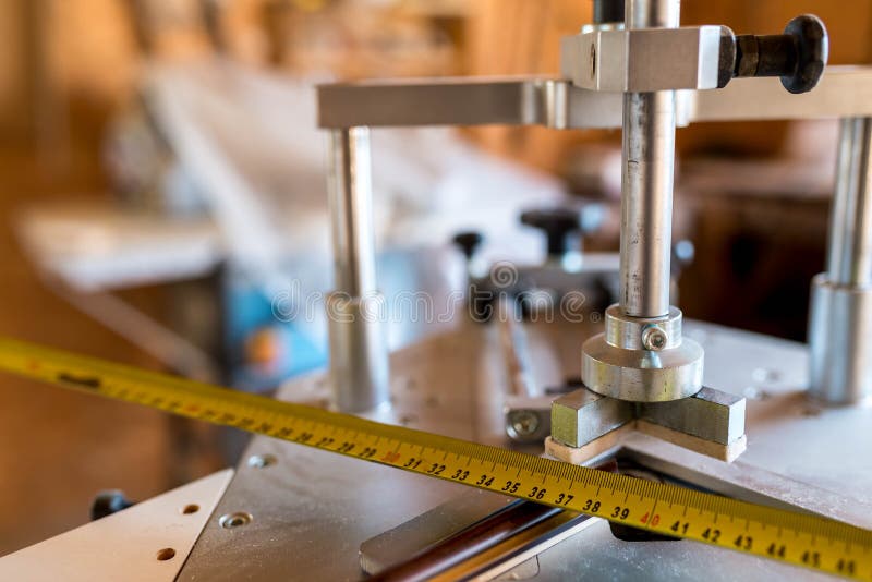 Underpinner on focus, picture framer tool in a small workshop, shallow depth of field. Closeup machine tool stock images, royalty-free photos and pictures