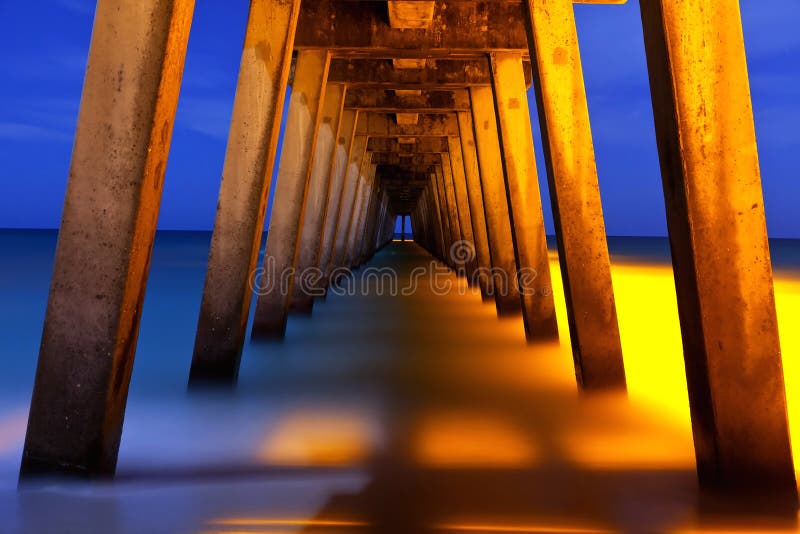 Underside of pier at night