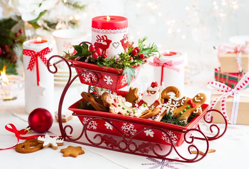 Christmas table decoration with biscuits,flowers and candles. Christmas table decoration with biscuits,flowers and candles