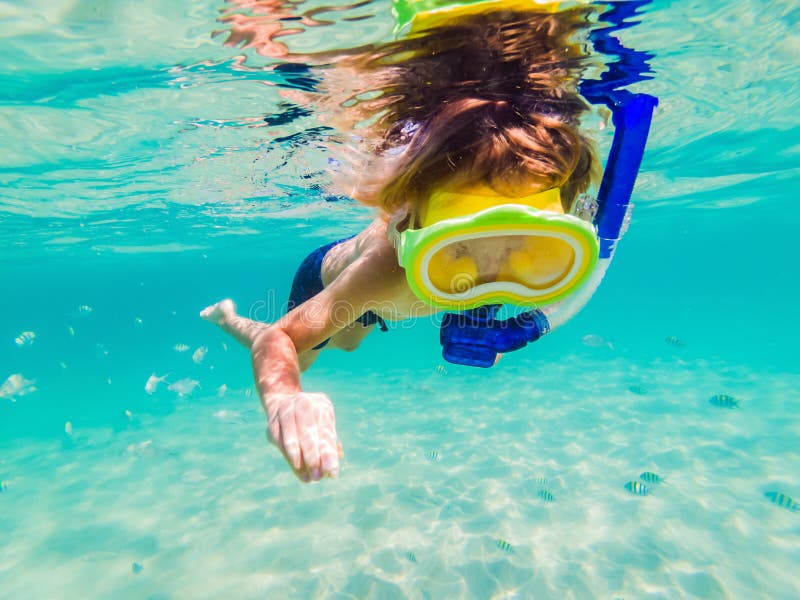 Underwater Nature Study, Boy Snorkeling in Clear Blue Sea Stock Photo