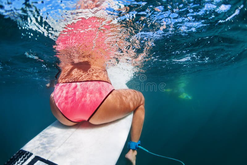 Underwater Photo Of Surfers Sitting On Surf Boards Stock Photo Image