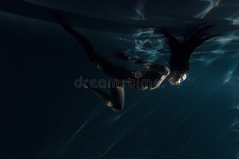 Underwater Shoot of Beautiful Woman with Long Hair Dancing in Water in ...