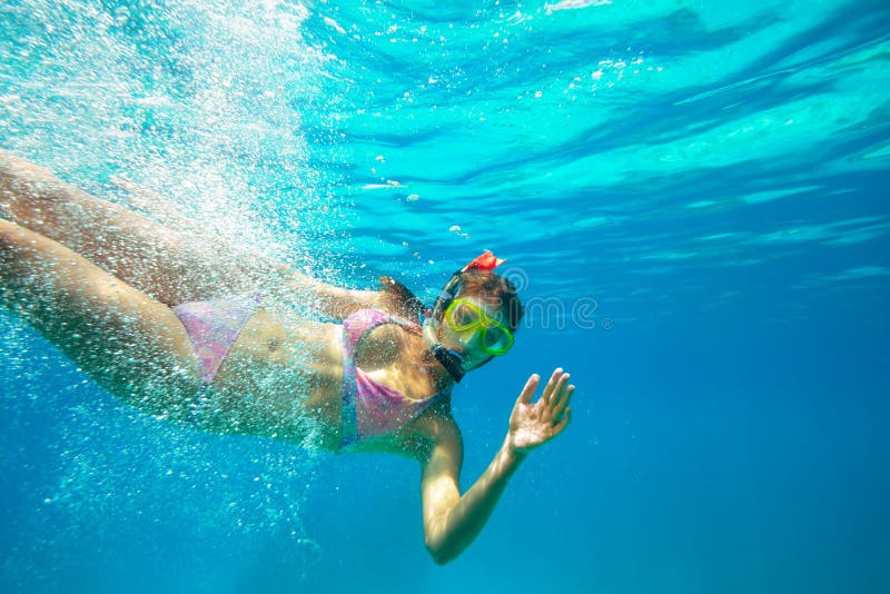 Underwater shoot of a young lady snorkeling stock image