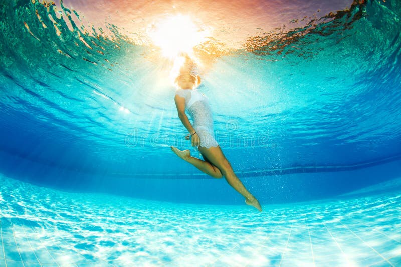 Underwater swimming and reflection in water