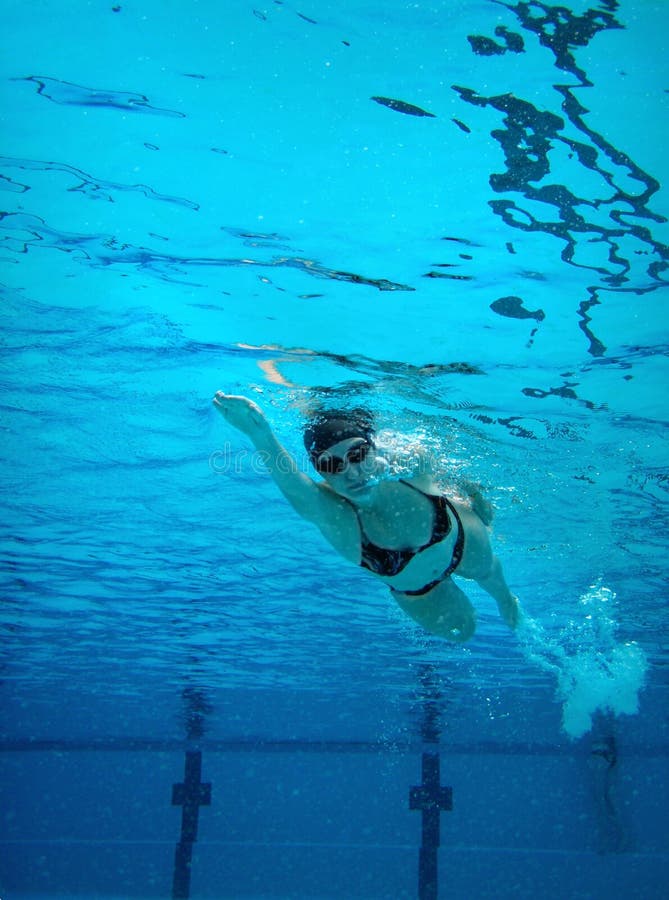 Underwater swimming woman