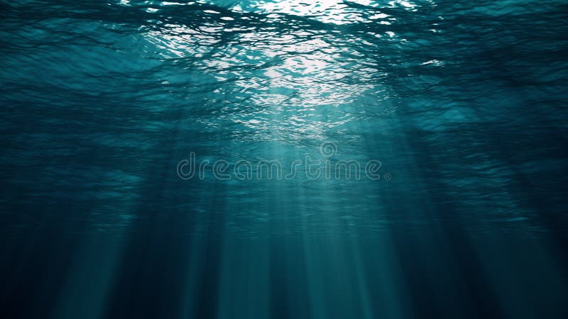 Underwater blue background in ocean with sunbeams Stock Photo