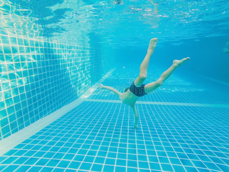 Underwater Young Boy Fun in the Swimming Pool with Goggles. Summer Vacation Fun royalty free stock image Underwater Young Boy Fun in the Swimming Pool with Goggles. Summer Vacation Fun royalty free stock image