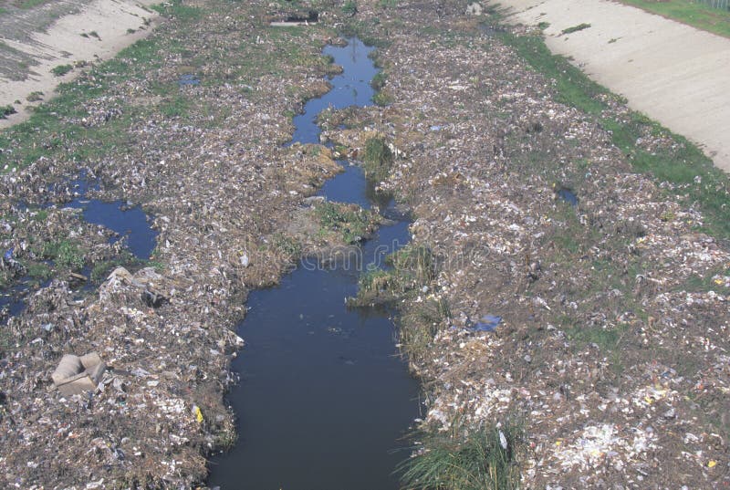 An undesignated urban dump on the Los Angeles River in Compton, California stock images