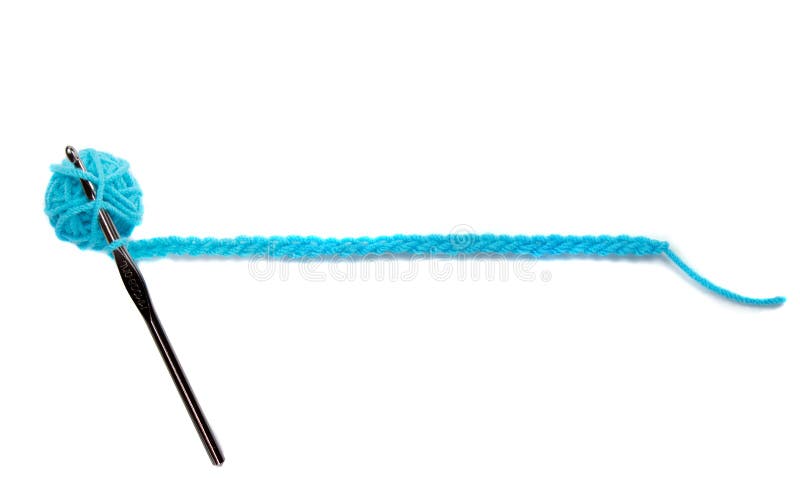 Une bille bleue de filé avec le pointeau de crochet photographie stock Une bille bleue de filé avec le pointeau de crochet photographie stock
