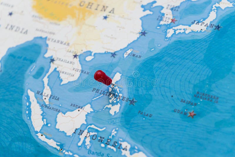Une goupille sur Manille, Philippines dans la carte du monde image stock Une goupille sur Manille, Philippines dans la carte du monde image stock