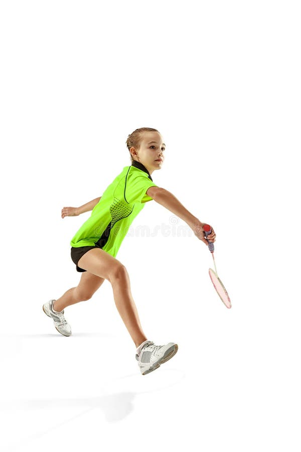 Une jeune femme caucasienne de fille d'adolescent jouant le joueur de badminton d'isolement sur le fond blanc photographie stock Une jeune femme caucasienne de fille d'adolescent jouant le joueur de badminton d'isolement sur le fond blanc photographie stock
