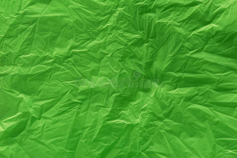 A green plastic bag texture, macro, background. A green plastic bag texture, macro, background