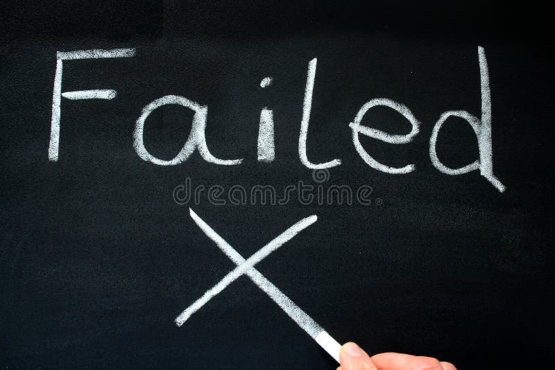 A teacher writing failed on a blackboard. A teacher writing failed on a blackboard.