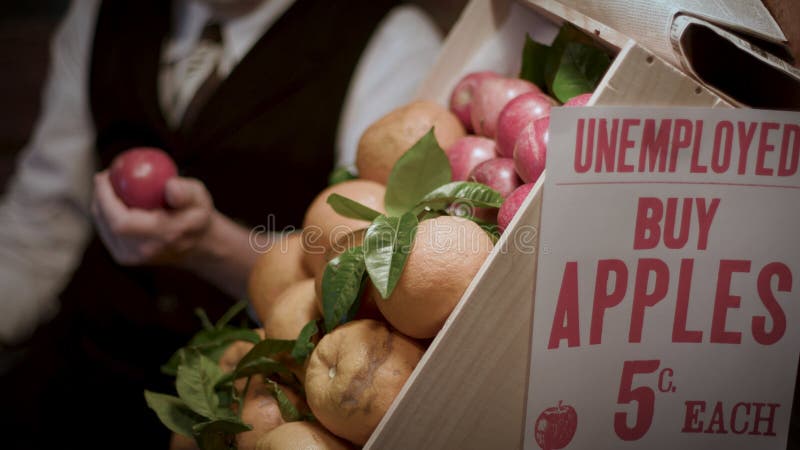 A peddler selling apples during the great depression of the 1930s.