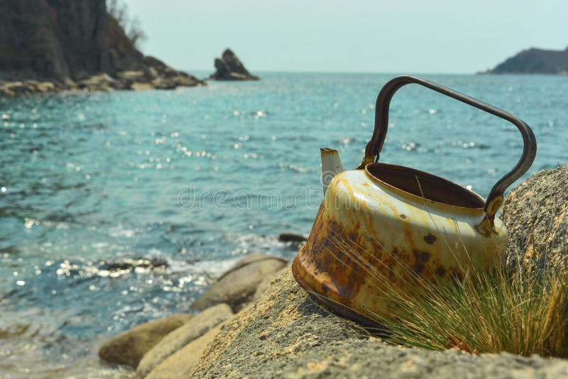 The Turquoise Sea And Rocks With Greenery Diagonal Composition Stock