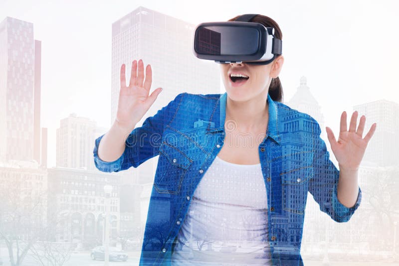 Beautiful woman being scared by VR game plot twist royalty free stock photography