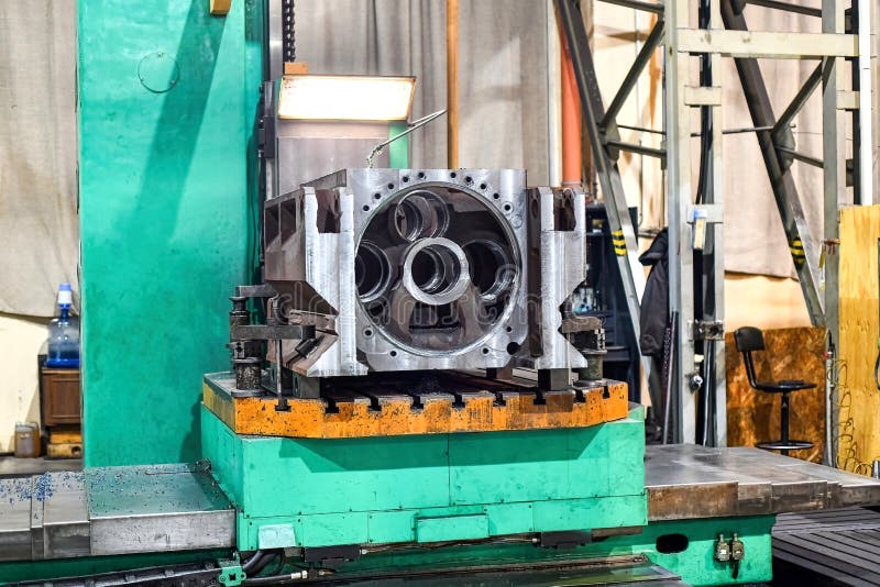 An Unfinished Metal Part is on the Machine in the Stock Image