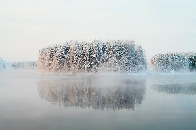 Unfrozen lake in the winter forests