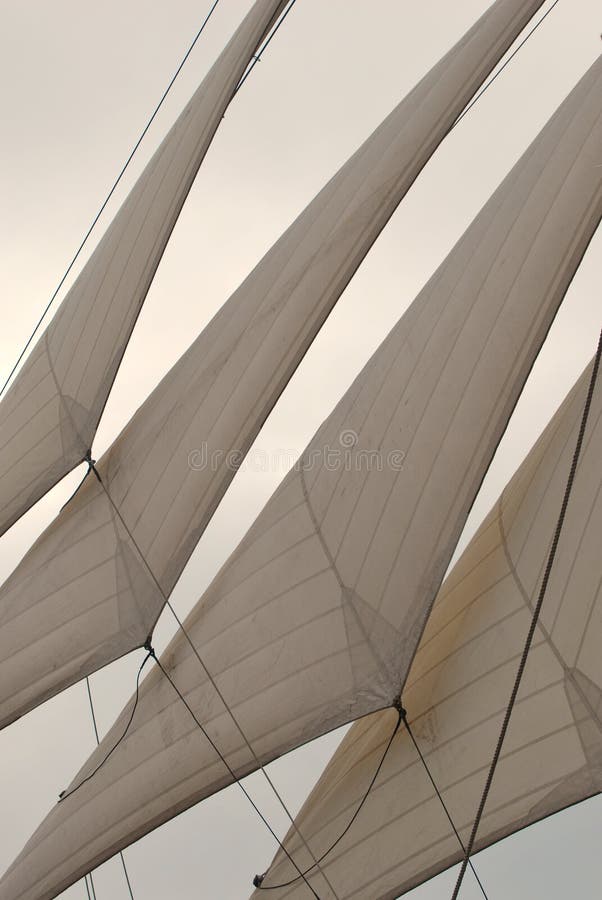 Unfurled jibs on a wooden sailing bark stock image