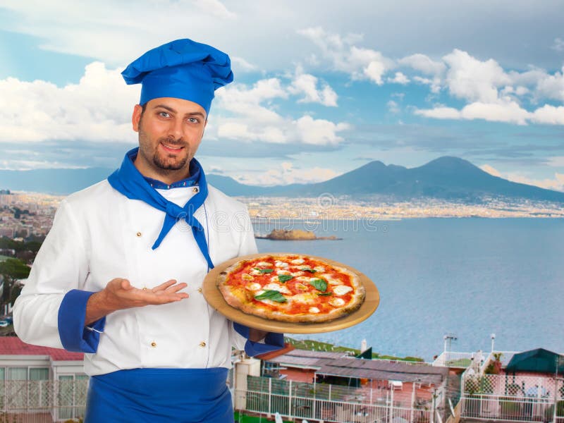 Young chef with neapolitan pizza margherita with Gulf of Naples in background. Young chef with neapolitan pizza margherita with Gulf of Naples in background.