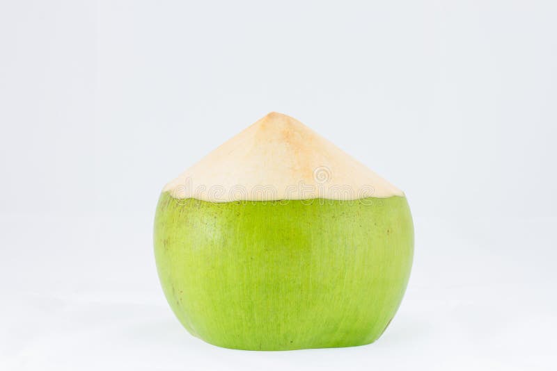 Ung kokosnötfrukt på vit bakgrund arkivfoto Ung kokosnötfrukt på vit bakgrund arkivfoto