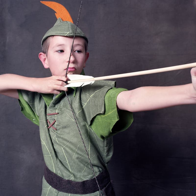 Young Robin Hood drawing a bow and arrow. Young Robin Hood drawing a bow and arrow