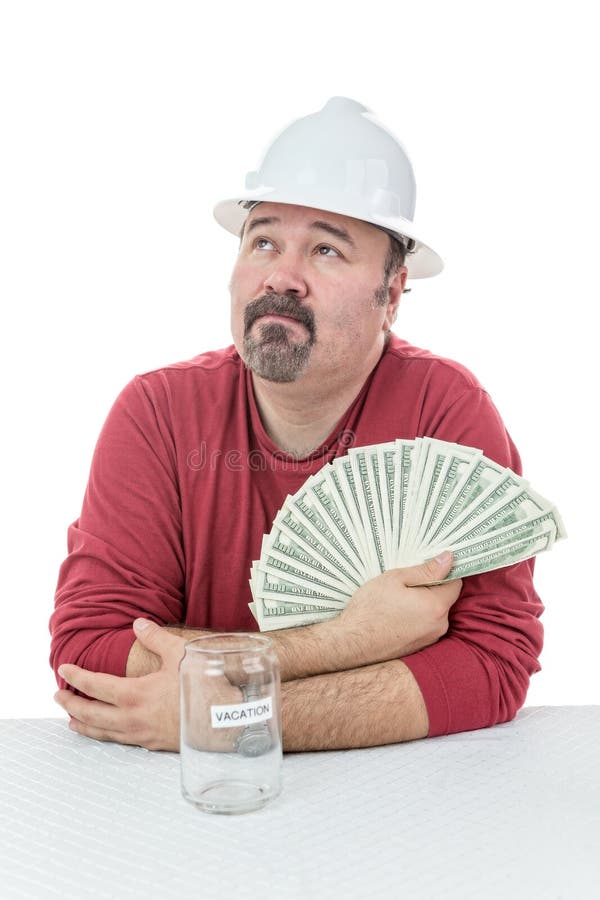 Unglücklicher Bauarbeiter, der zum Steuergeld hält lizenzfreie stockfotografie Unglücklicher Bauarbeiter, der zum Steuergeld hält lizenzfreie stockfotografie