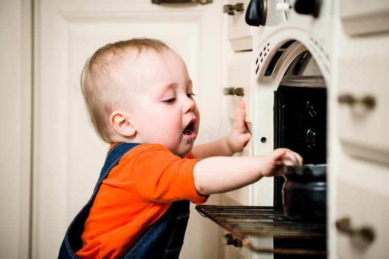 Unguarded baby with open oven